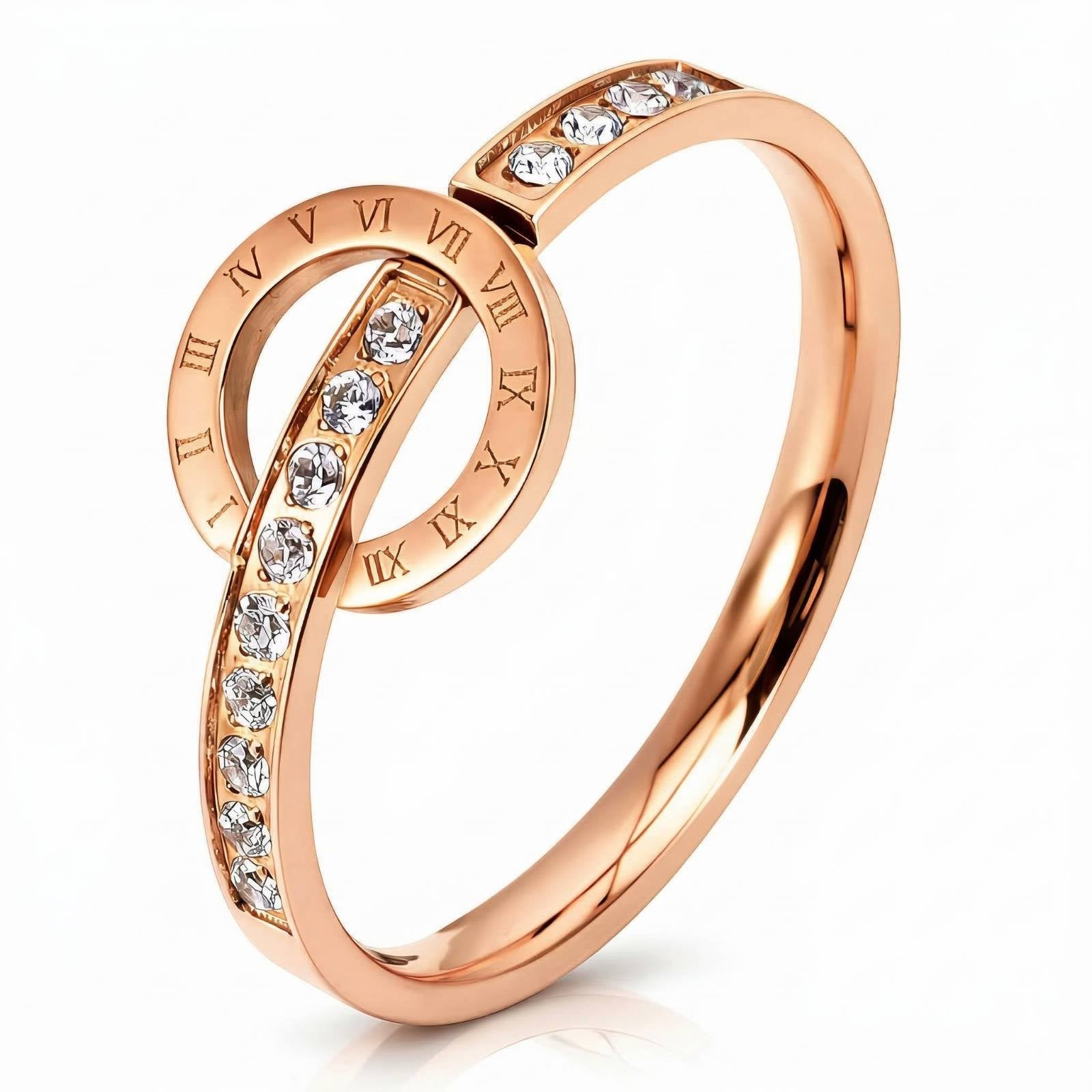 Ring mit Roségoldbeschichtung, römischen Ziffern und funkelnden Steinen